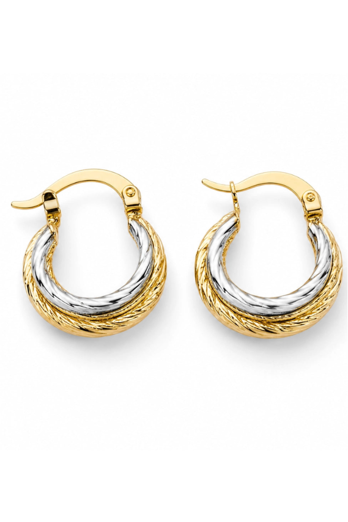 Pair of gold and silver hoop earrings on a white background