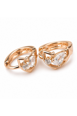 Pair of rose gold heart-shaped rings with clear gemstones on a white background