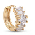 Gold hoop earrings with clear gemstones on a white background