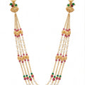 Multistrand necklace with gold, pearl, and gemstone beads on a white background
