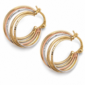 Gold and rose gold hoop earrings on a white background